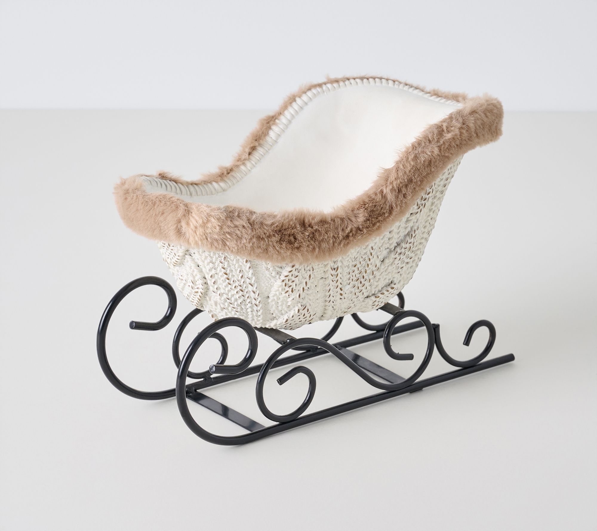 Cable Knit Resin Sleigh with Faux Fur Trim by Valerie