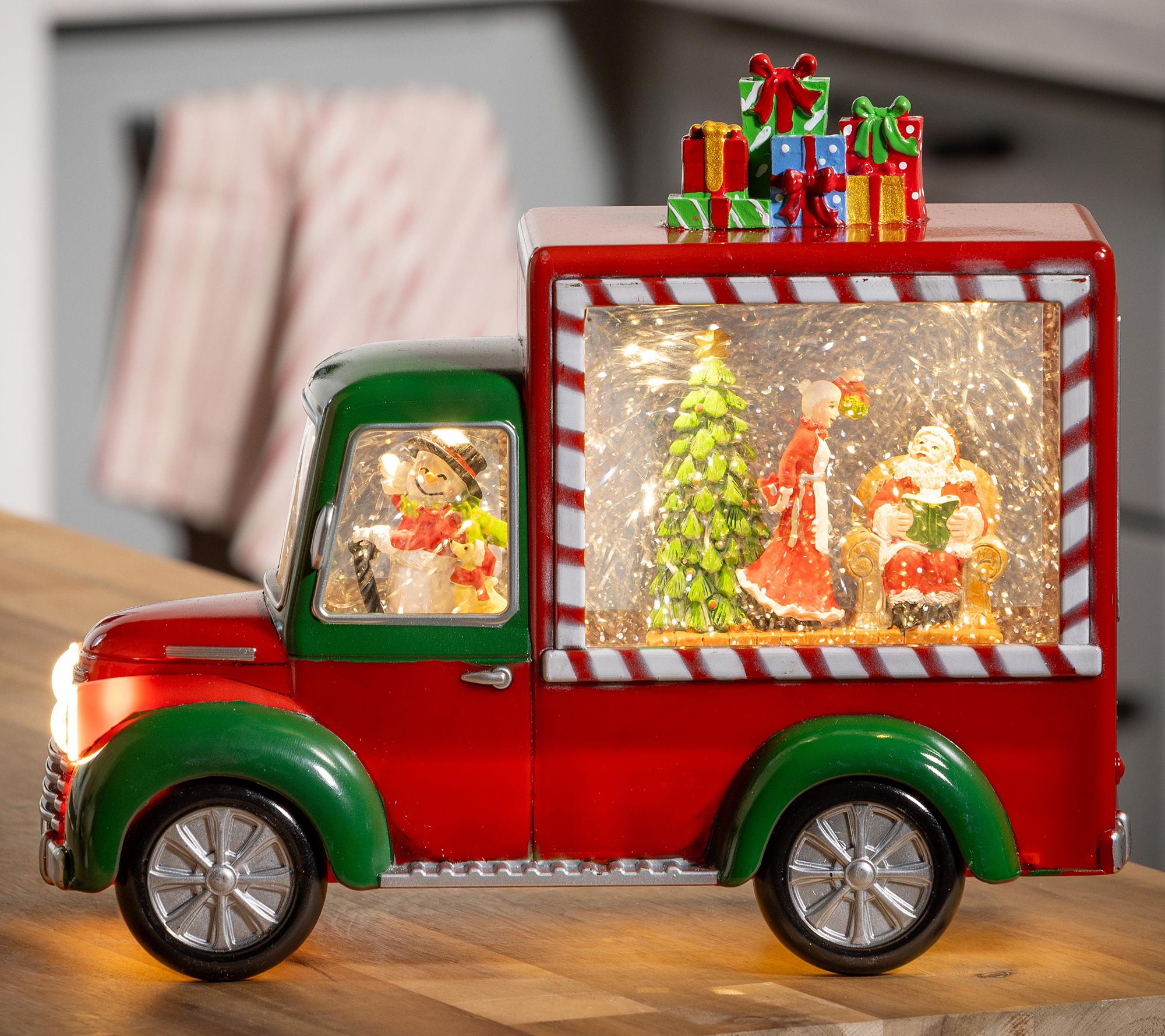 Evergreen 9"L LED Santa & Mrs. Claus in Truck Water Lantern