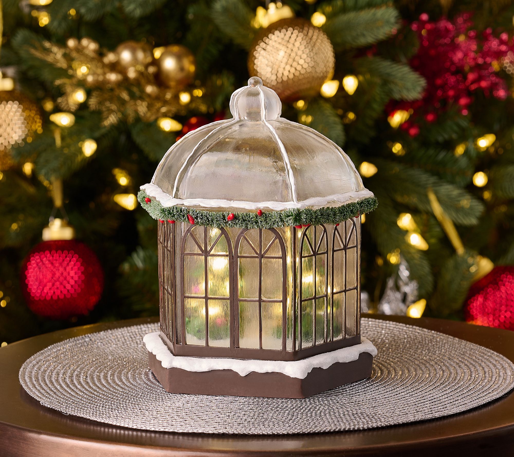 Illuminated Snow-Dusted Gazebo with Trees by Valerie
