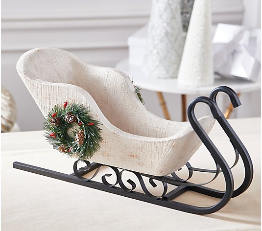 Antiqued Sleigh with Bottlebrush Wreath by Valerie