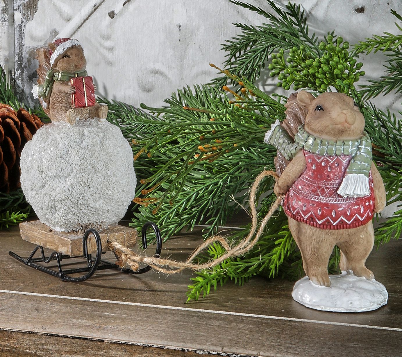 6.5" Squirrel Pulling Snowball On Sled by Valerie