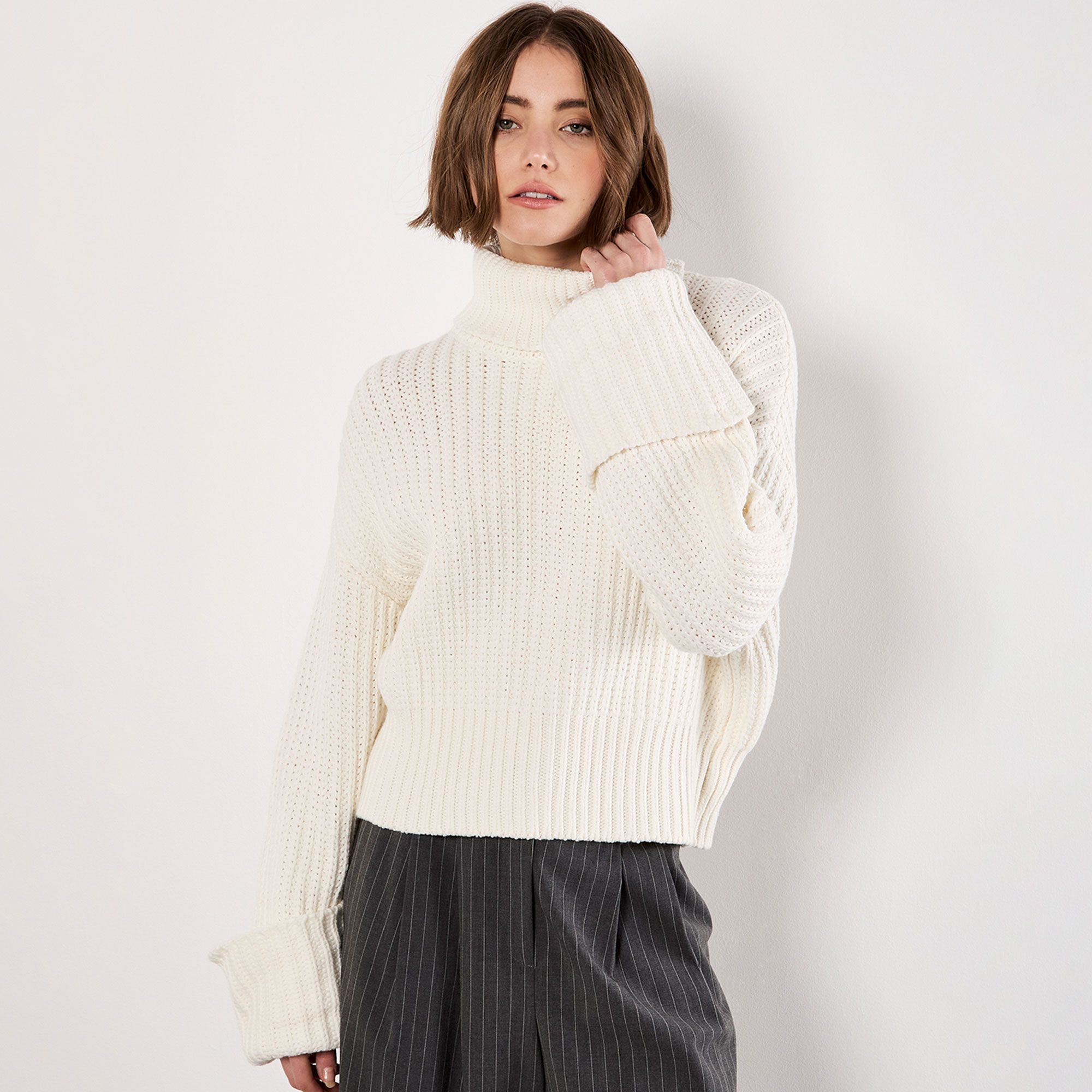 Apricot
Maglione a collo alto
in cotone con manica
lunga