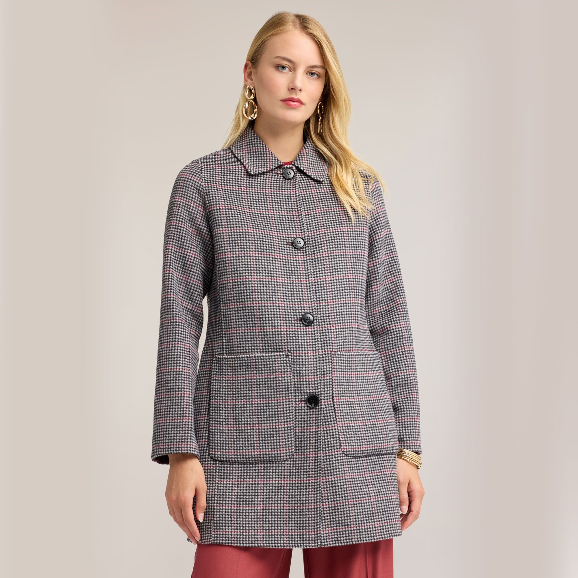 Motivi
Cappotto reversibile
in misto lana a
maniche lunghe