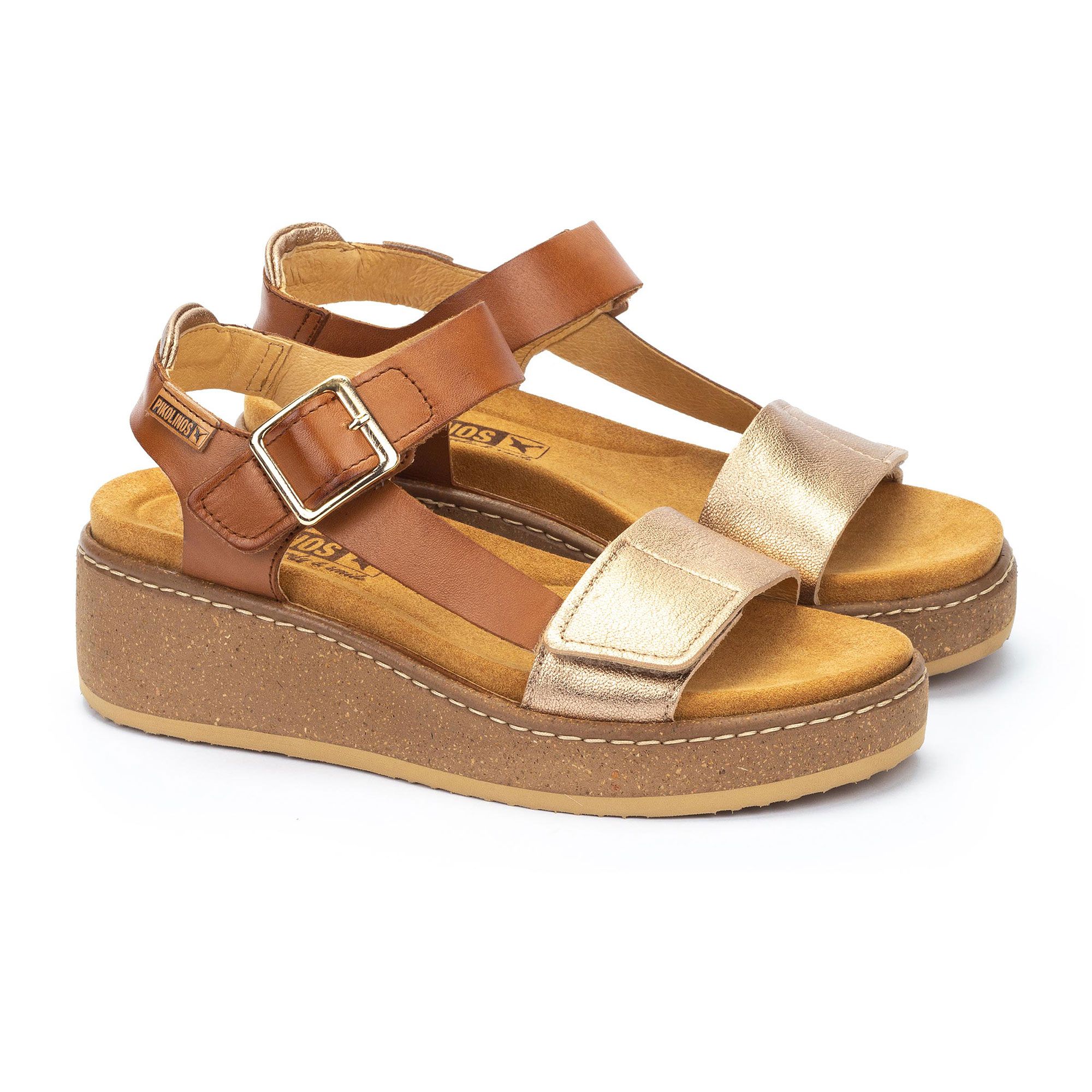 Pikolinos
Sandali in pelle
laminata
con zeppa 6cm