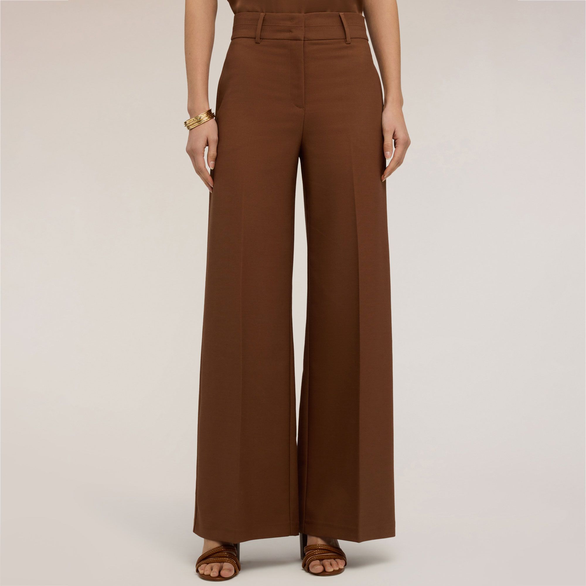 Motivi
Pantaloni a gambia
ampia con tasche