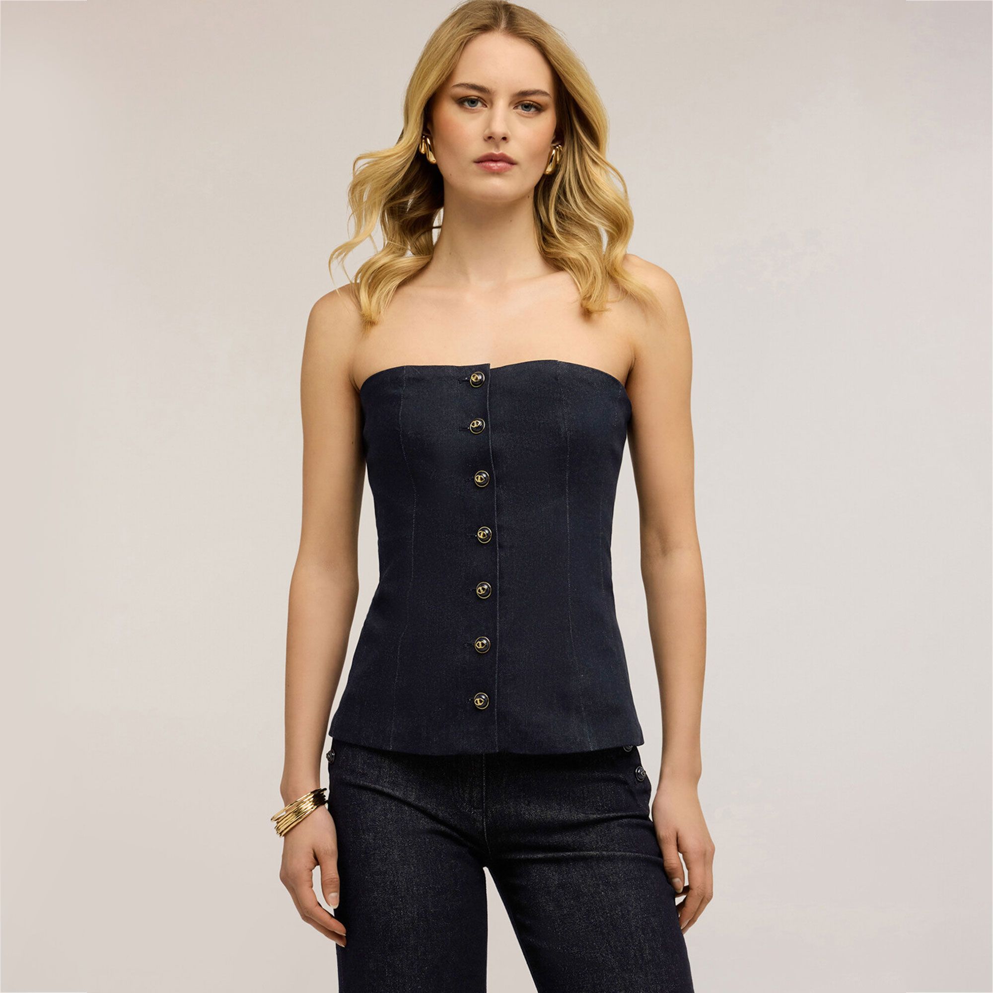 Motivi
Top bustier
smanicato