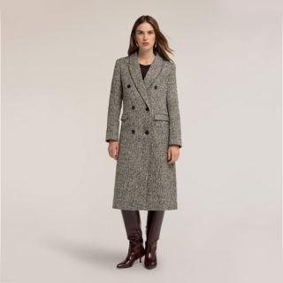 Motivi
Cappotto spigato
con lana
e fodera interna