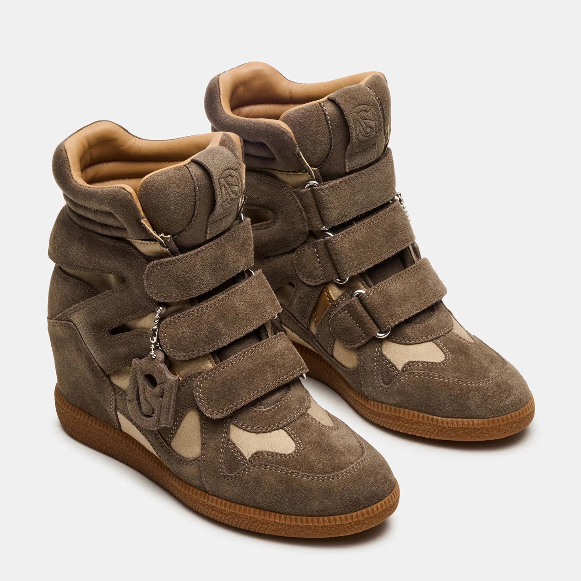 Steve Madden
Sneaker alte
in pelle scamosciata
con zeppa interna
