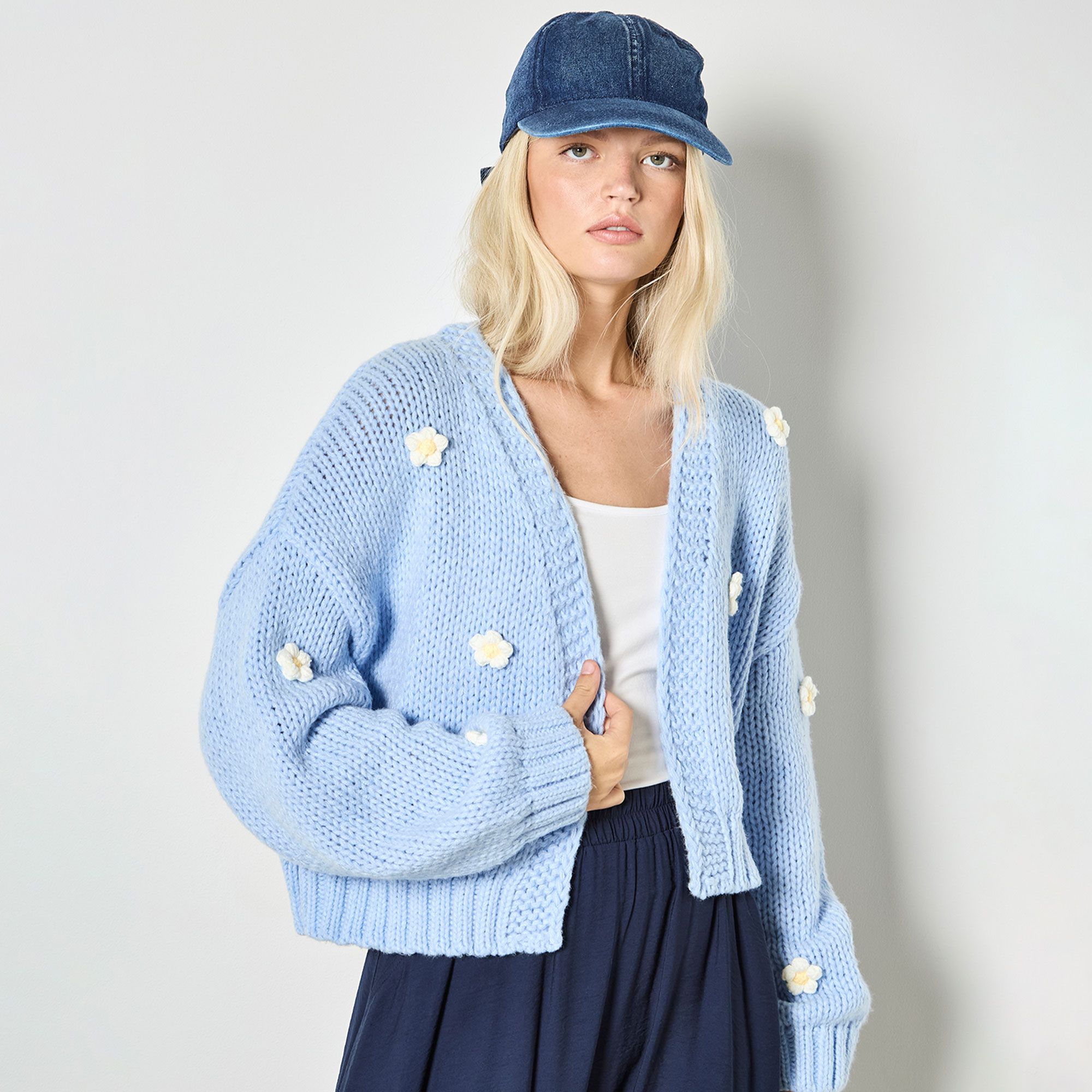 Apricot
Cardigan con
bordi in costa