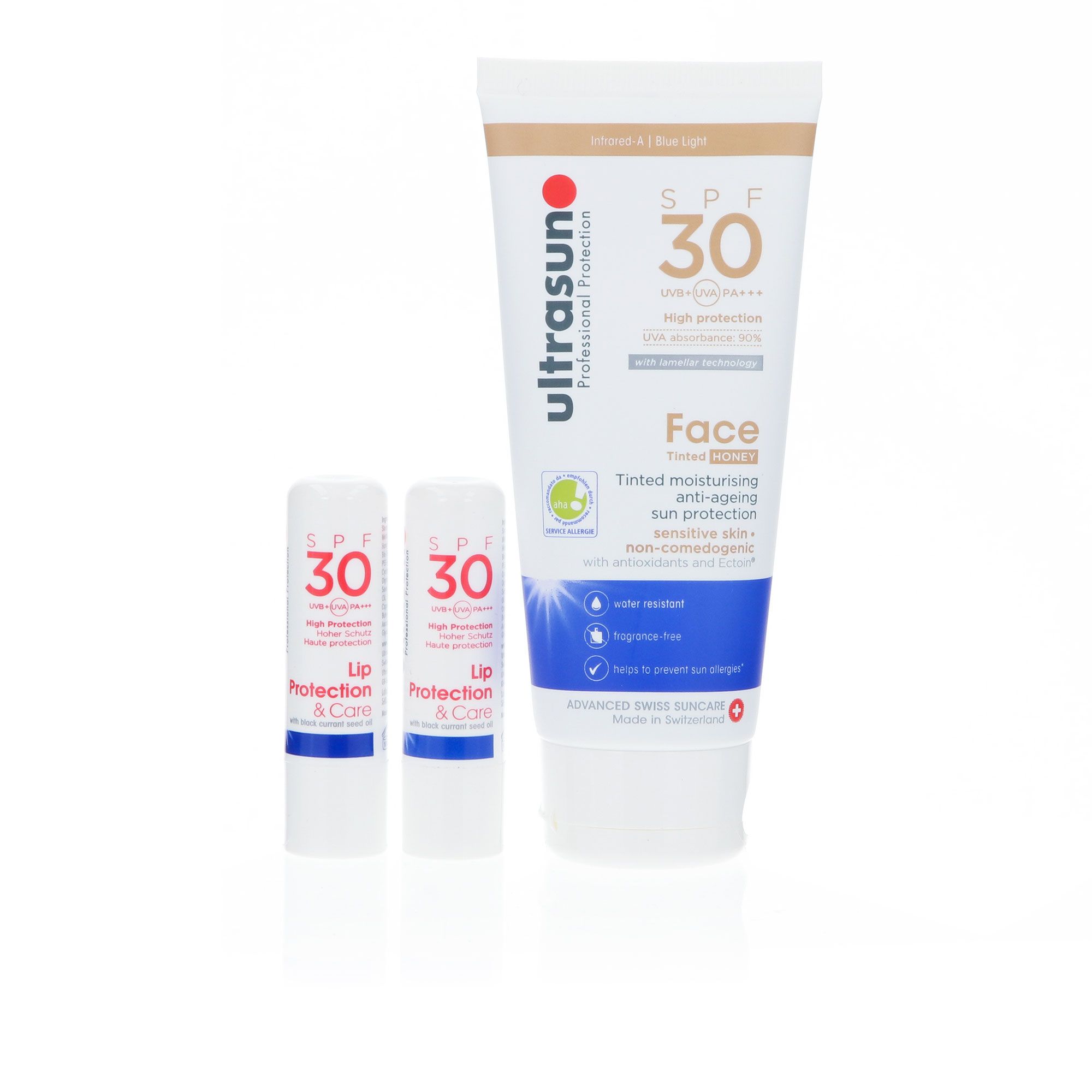 Image of Ultrasun Protezione viso Tinted Face SPF30 + 2 balsami labbra061