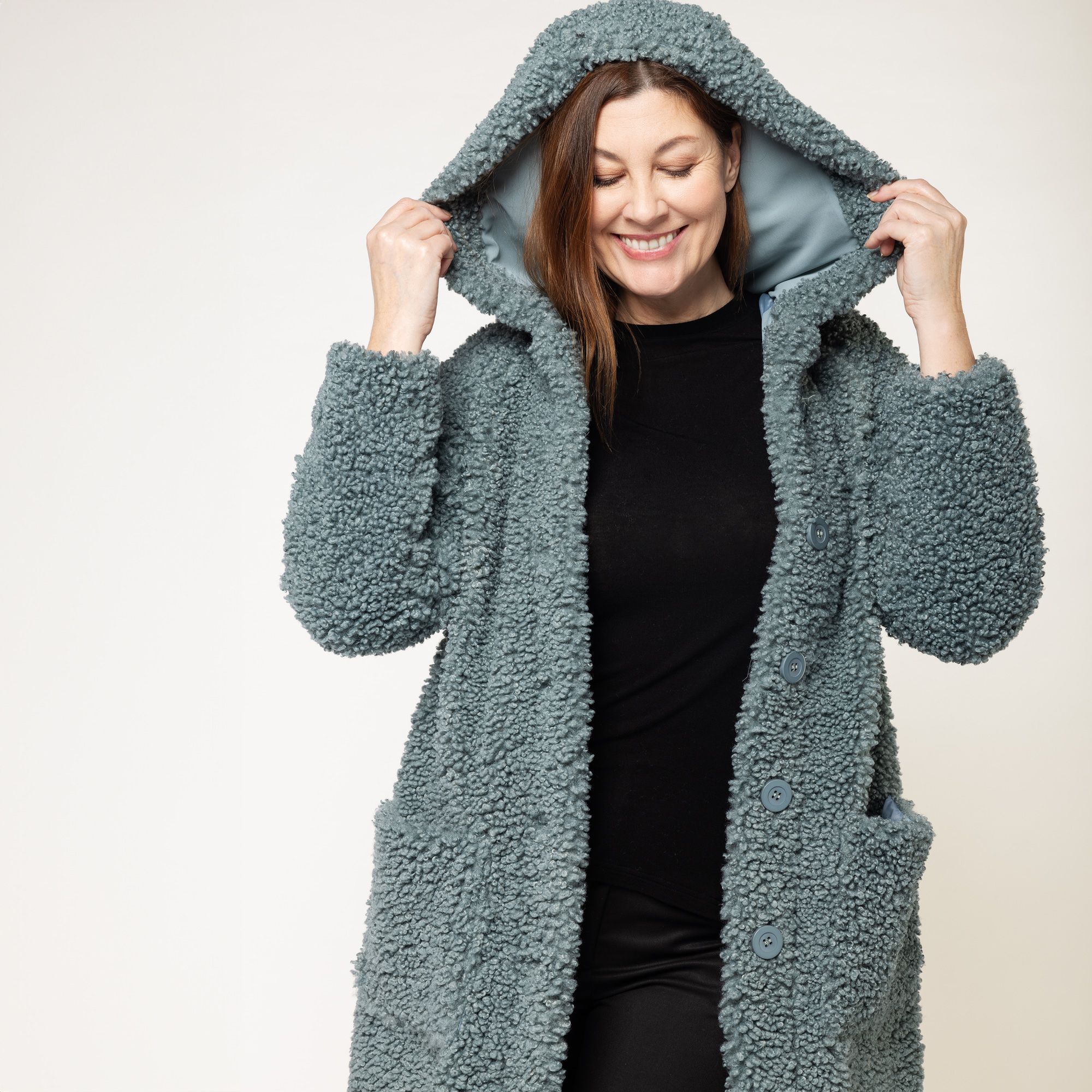 Caterina Lancini
Cappotto teddy
con cappuccio
e tasche