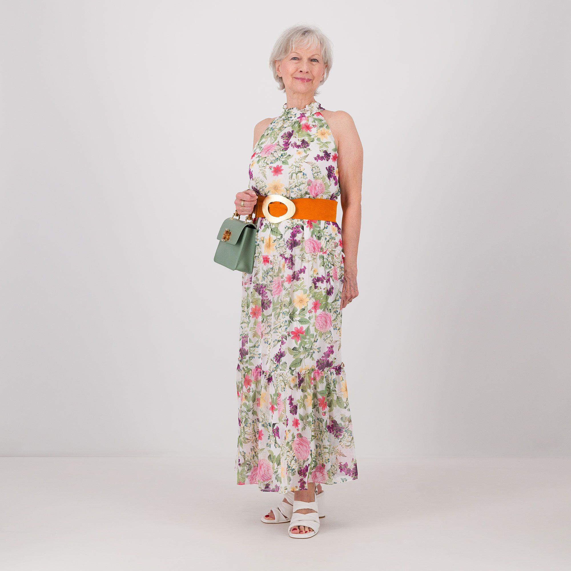 Nina Leonard
Abito smanicato
in chiffon fantasia
con balze