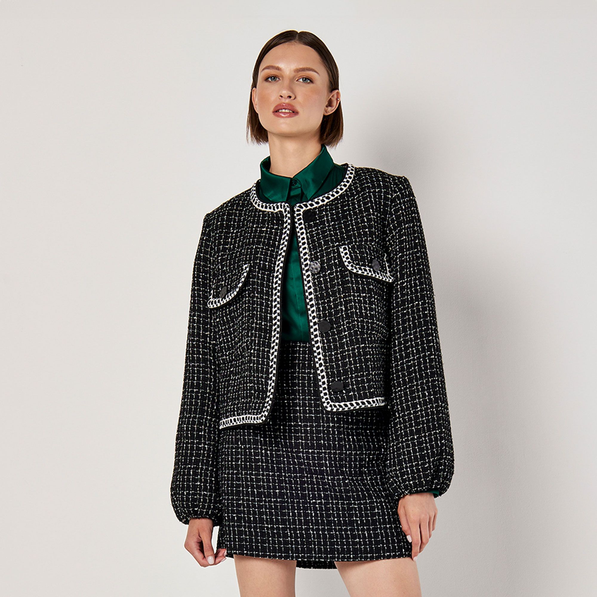 Apricot
Giacca cropped
in tessuto tweed
con 2 tasche