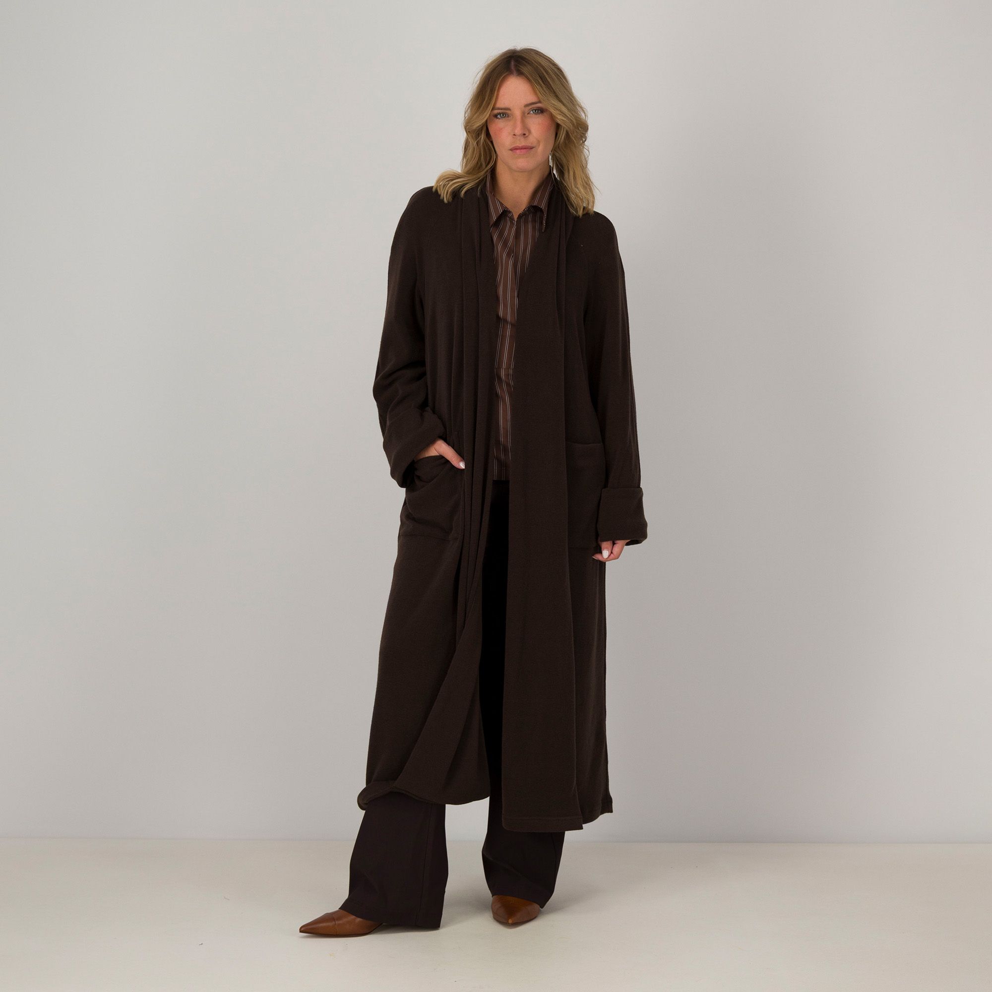 Caterina Lancini
Cardigan lungo in
maglia con tasche
a maniche lunghe