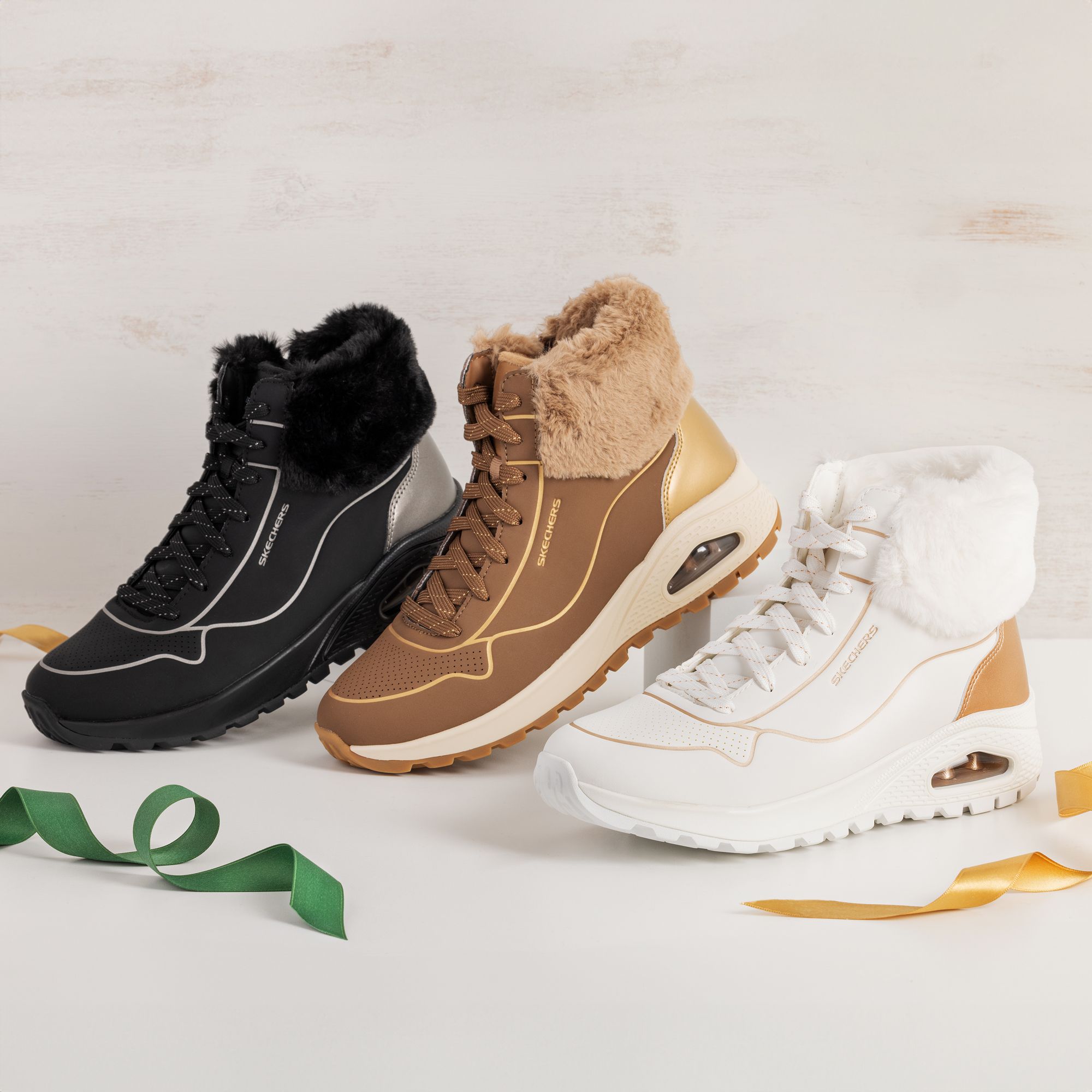 Skechers
Stivaletti Uno 
con zip laterale
e soletta Air-Cooled