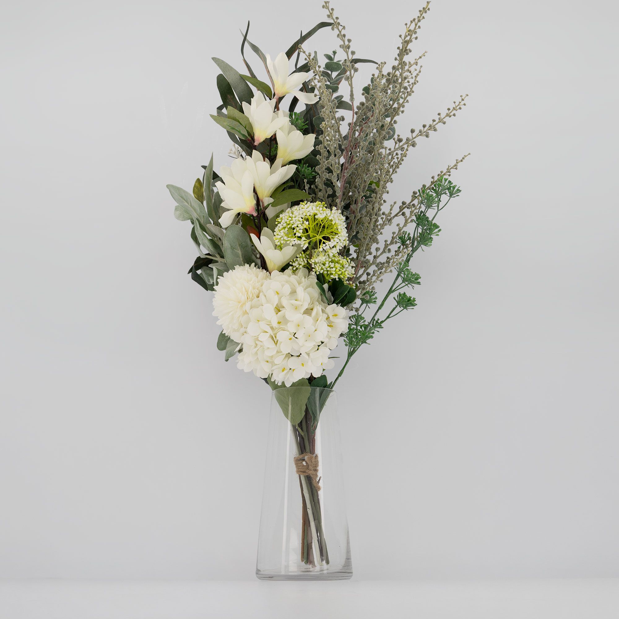 Home stories
Bouquet di fiori
artificiali con
vaso in vetro