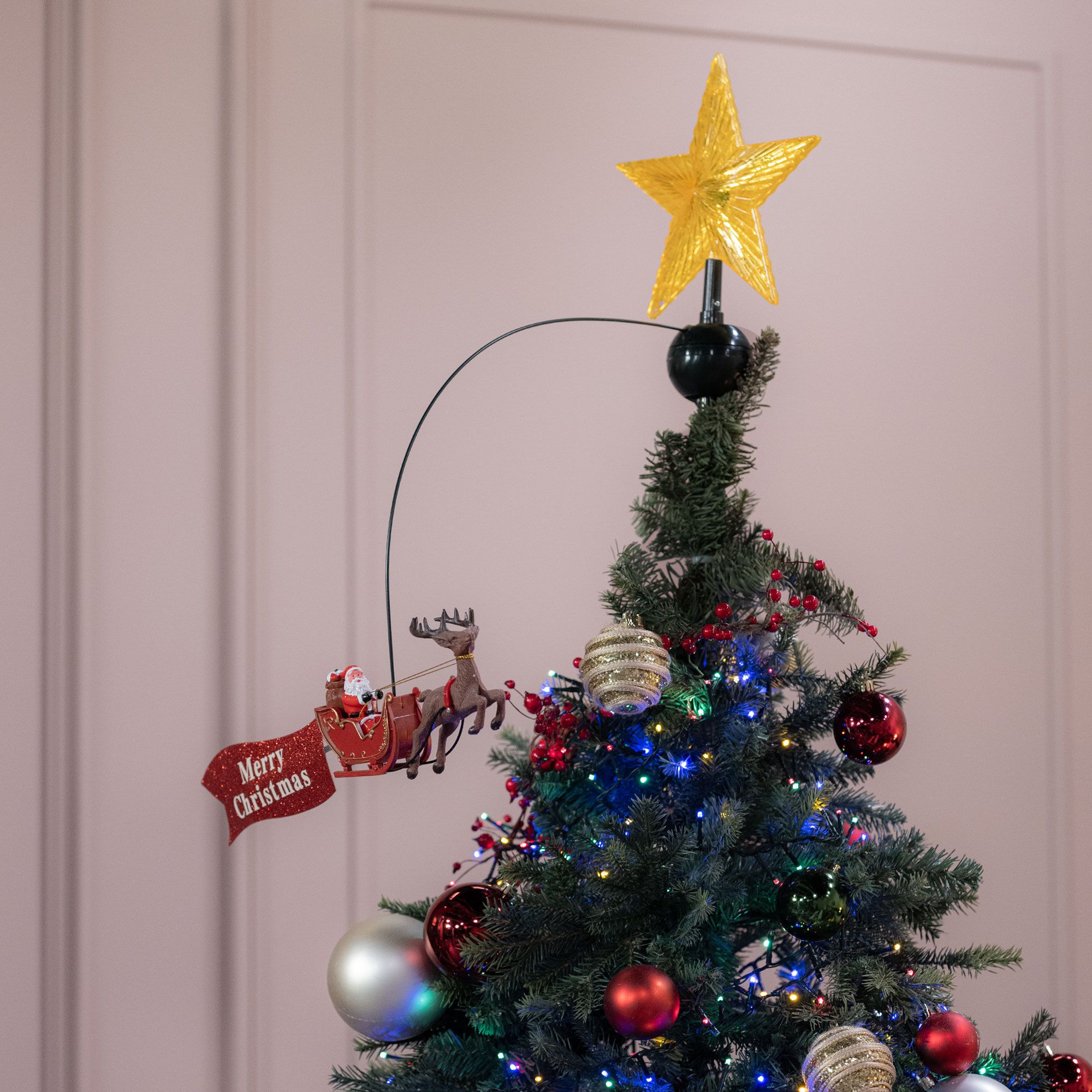 Santa Express
Puntale per albero
con stella e Babbo
Natale rotante