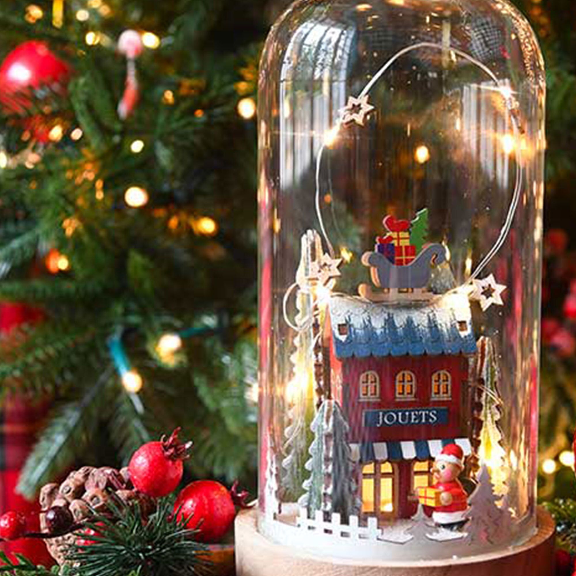 Campana luminosa in vetro e legno con negozio di giocattoli