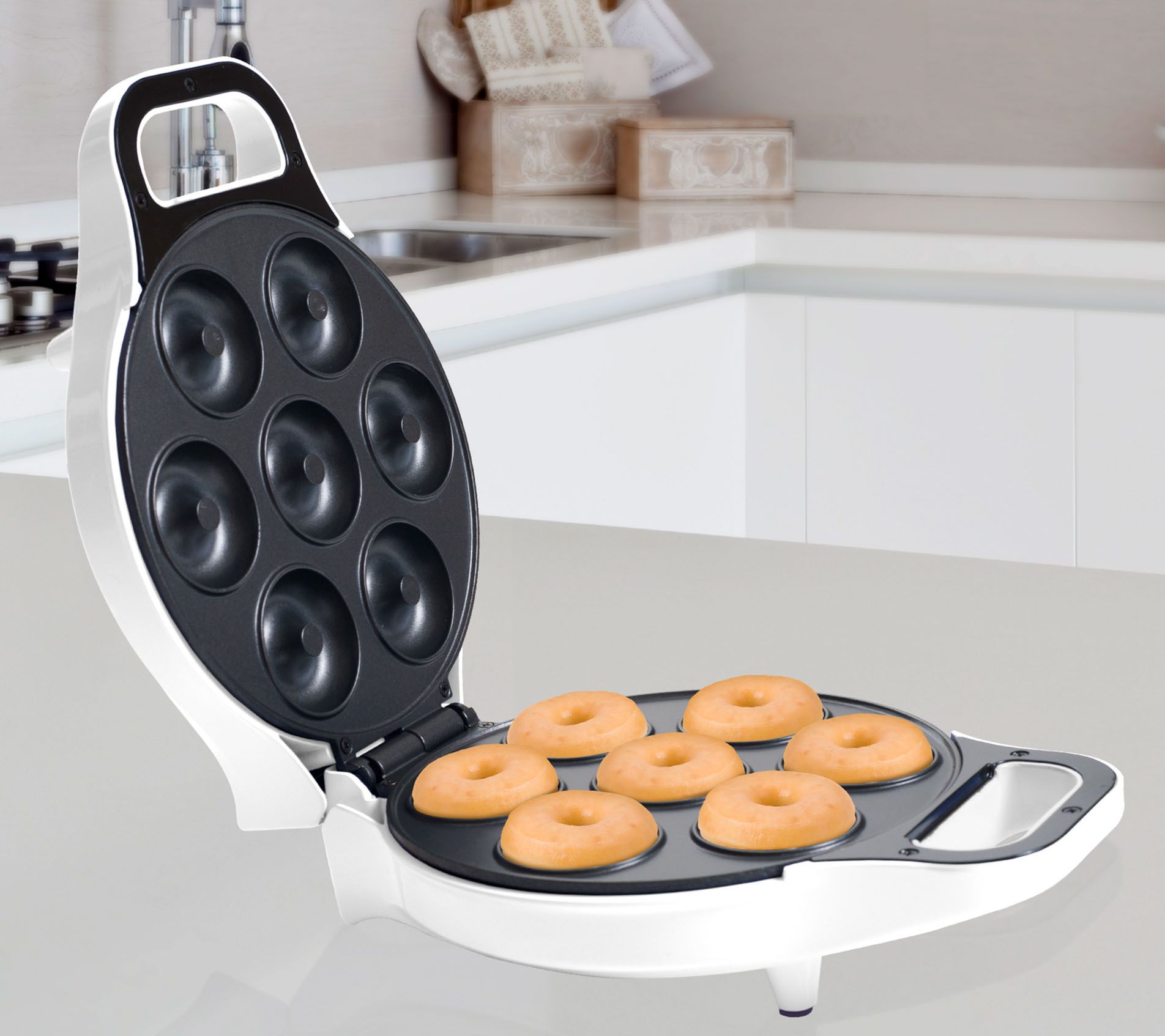 Pancake mix donuts in the BabyCakes Donut Maker, easy breakfast idea.