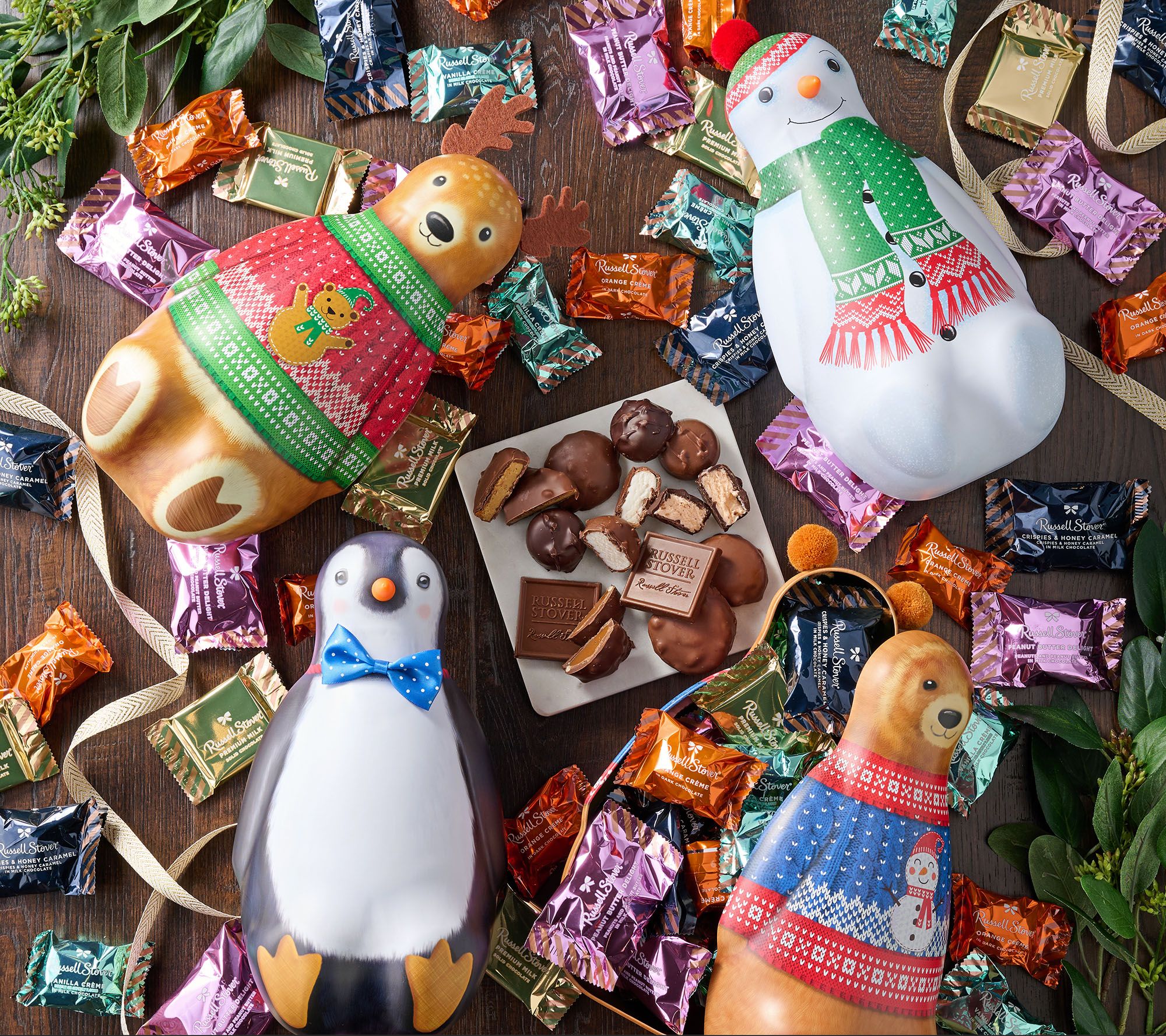 SH12/8 Russell Stover 100pc Chocolates in (4) Holiday Character Tins