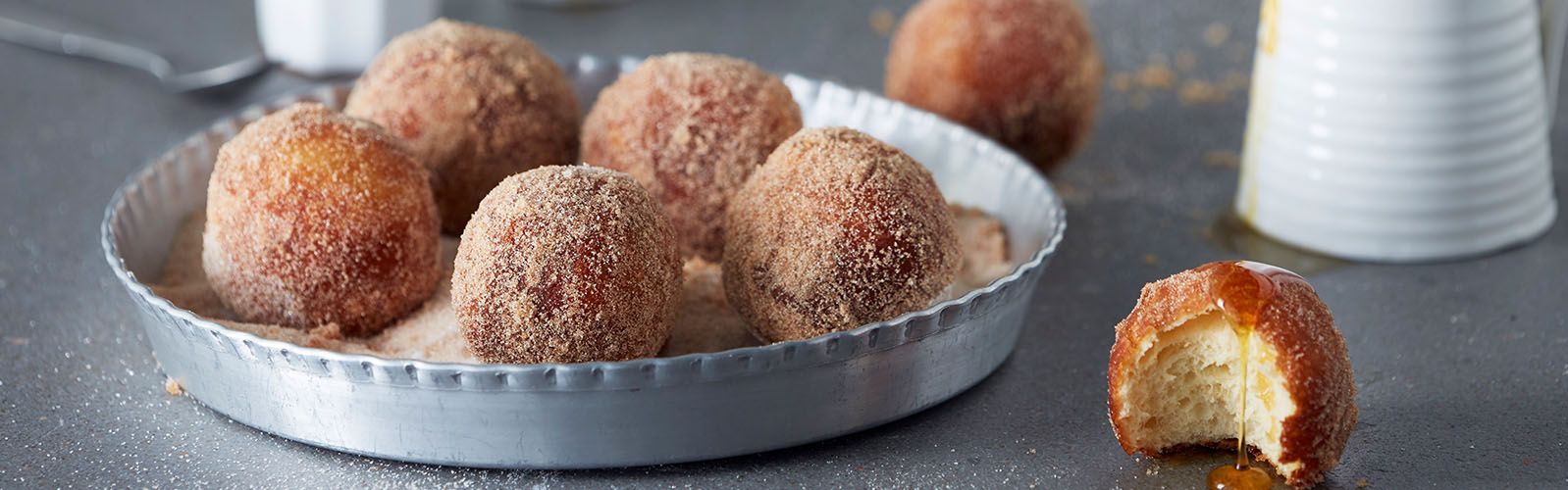 Cinnamon-dusted doughnuts with a caramel apple dipping sauce