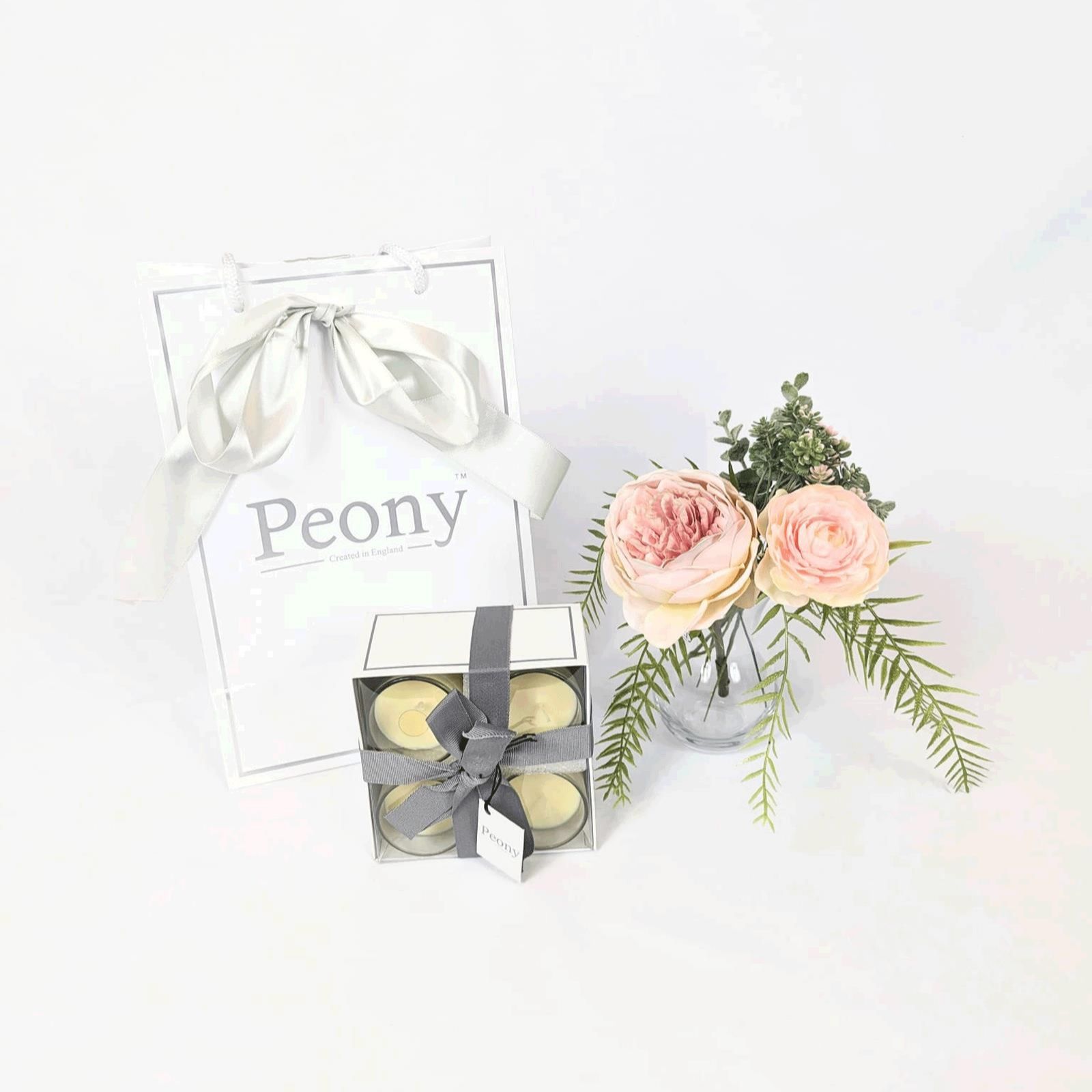 Peony Roses, Ranucula & Foliage in a Dainty Hourglass Vase w/ 4 Candles & Bag